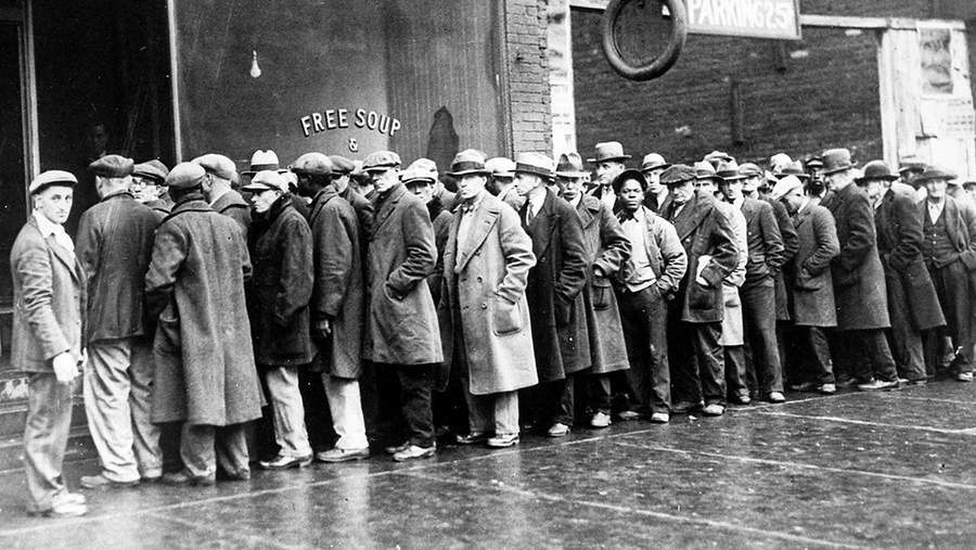 The Great Depression. Unemployed men queued outside a soup kitchen opened in Chicago by Al Capone. The storefront sign reads 'Free Soup, Coffee and Doughnuts for the Unemployed.' Chicago, 1930s (Newscom TagID: evhistorypix027753.jpg) [Photo via Newscom]