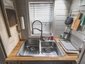 Фото кухни домика на колесах Little Bitty Tiny House