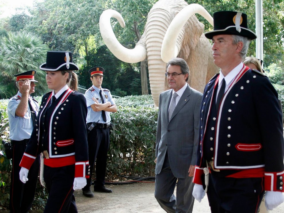 Catalan Regional President Mas walks during a ceremony at the regional parliament marking the Catalan National Day in Barcelona