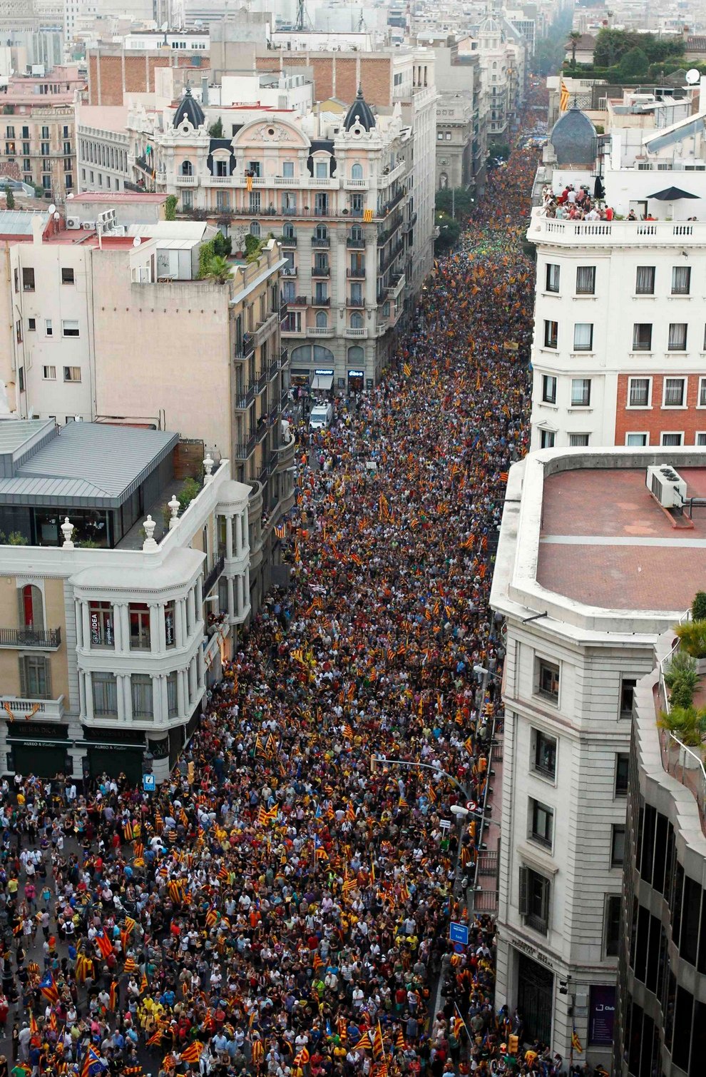 Marchers demonstrate during Catalan National Day in Barcelona